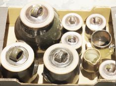 Set of seven studio pottery brown glazed lidded storage jars, largest 26cm high together with a