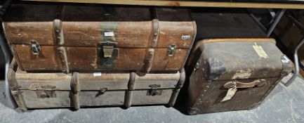 Three canvas, wood and metal bound suitcases and a small leather apothecary style bag (4)