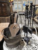 Fireside companion set, an oak and leather mounted bellows and a copper helmet-shaped coal scuttle