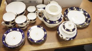 Victorian china part tea service with blue and gilt borders to include teapot (spout detatched), the