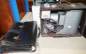Black leather satchel and a vintage wooden cased Johnson Diascope