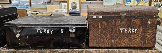 Two metal trunks, one painted in black the other in brown wood grain effect, and two black painted