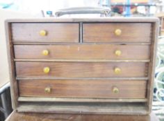 Early 20th century wooden table-top tool chest with leather carry handle and three long drawers