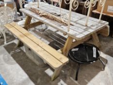 Six-seater wooden picnic table with fold-up seats