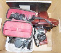 Camera equipment and accessories including Praktica camera, Nikon camera, various lenses, Sigmund