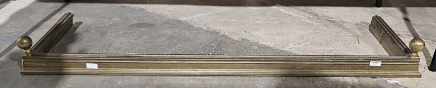Brass fireplace fender with beaded trim to top. Condition Report Width 132cm Depth 35cm