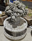 Composite stone garden basket of flowers on a large circular base, 73cm high