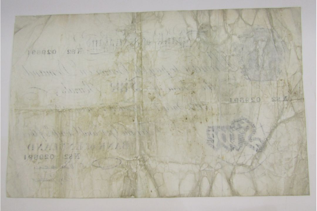Bank of England £5, signed P S Beale (1949-1952), prefix N82 029891, stained and folds, small pin - Image 2 of 2