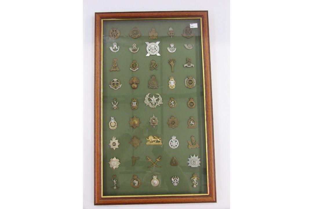 Framed collection of 45 British military cap badges