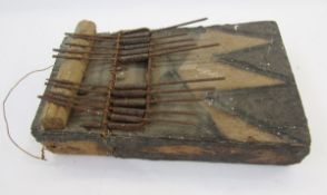 African carved wooden tribal thumb piano with painted geometric design to both the front and rear,