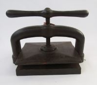 An antique cast iron book press with club handle and central screw thread, 'Francis Preston