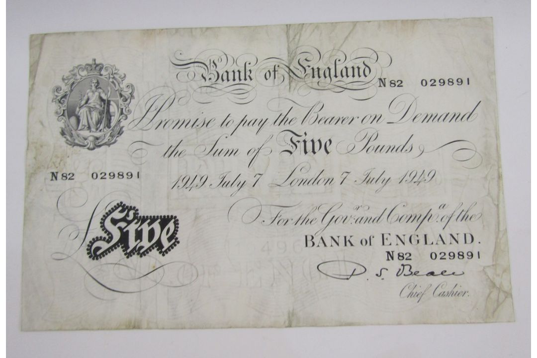 Bank of England £5, signed P S Beale (1949-1952), prefix N82 029891, stained and folds, small pin - Image 1 of 2