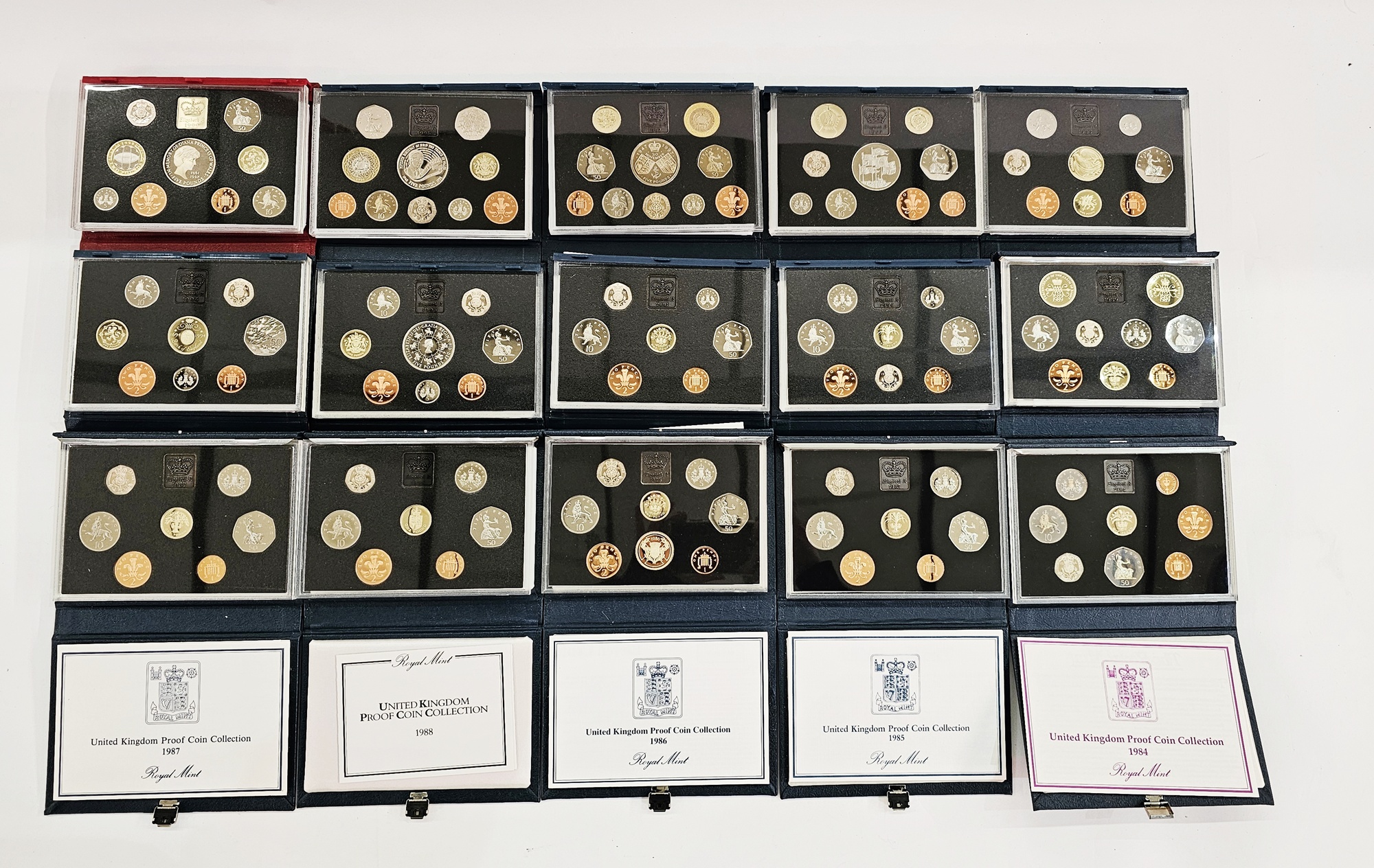 GB coins: Box of 15 Royal Mint QEII decimal proof coin sets 1984-1999, including 1989 Scottish Claim