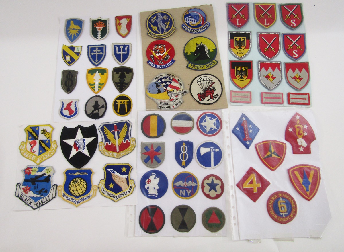 Collection of American military cloth badges together with a collection of West German military