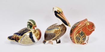 Three Royal Crown Derby bone china animal paperweights comprising the Brown Pelican circa 1998, 13.
