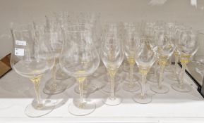 Contemporary facon-de-Venise glass part table-service, with gilt wrythen-moulded stems,