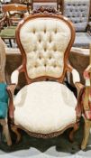 Victorian-style hardwood open armchair, the top rail with floral carved cresting, the gold-
