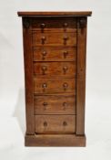 19th century rosewood wellington chest with seven graduated drawers, each with two turned knob