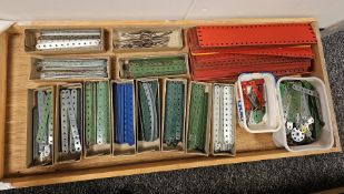 Two trays of Meccano strips of various lengths, shapes and colours