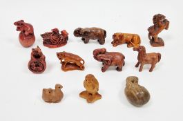 Six Japanese netsukes in the form of animals including owl, horse, elephant, mouse, camel and