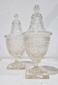 Pair of cut-glass Regency sweetmeat jars and covers, each cut with diamonds and flutes, on square
