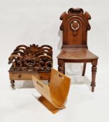 Victorian rosewood canterbury with four carved and pierced divisions, single frieze drawer, on