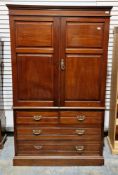 Edwardian mahogany linen press, the moulded cornice over two panel doors opening to four pull-out