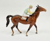 Beswick pottery figure of a racehorse and jockey, no.24, rider in yellow and pale green colours,