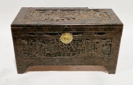 South East Asian camphorwood blanket chest with carved relief panels depicting figures chasing an