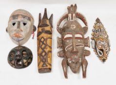 Five African wooden tribal face masks including Ghana beaded mask,  4.5cm diameter, Papua New Guinea