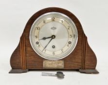 Garrard of London early 20th century oak domed top mantel clock, the face with three winding holes