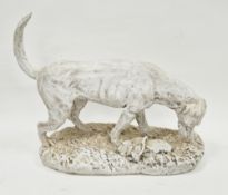20th century white painted plaster sculpture of a hound, standing fore-square sniffing the ground,