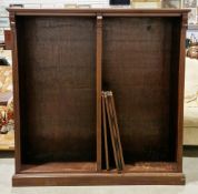 Mahogany dwarf double bookcase with ogee cornice having twin compartments of adjustable bookshelves,