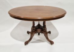 Victorian mahogany oval tilt-top breakfast table raised on four turned baluster pillars, united on a