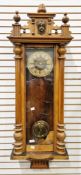 19th century walnut cased Vienna-style regulator wall clock, the carved urn and column pediment with