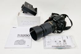 Nikon D3200 digital camera together with accessories and user manual with Nikon DX AF-S Nikkor 55-