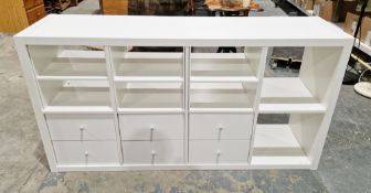 Modern Ikea Kallax white storage cabinet comprising three pull-out shelves, two further shelves