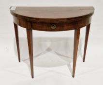 Mahogany demi-lune fold-over card table in the Sheraton manner, the hinged top opening to a green