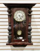 19th century mahogany cased eight-day hanging wall clock, the glazed door with carved column sides