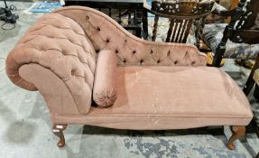 Modern small chaise longue in the Victorian manner, the pink upholstery with buttoned scroll arm and