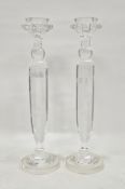 Pair of large contemporary cut-glass candlesticks, with knopped faceted pillar stems, on domed