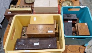 Twenty six sets of mainly brass weights, all decimal, contained in mainly wooden and a few plastic