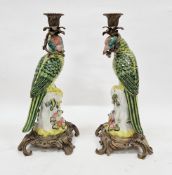 Pair of 20th century gilt-metal mounted Continental porcelain parrot candlesticks in the Meissen