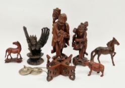 Group of Chinese and South East Asian carved figures including a lamp base of immortal carrying a