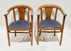 Pair of early 20th century pale beechwood tub chairs with central solid shaped splats and drop-in