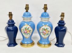 Two pairs of contemporary porcelain table lamps comprising a pair of Sevres-style pale powder blue
