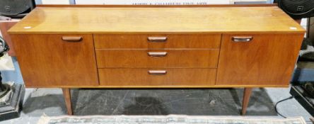 Mid-century retro teak sideboard by Meredew, comprising a central bank of three drawers flanked