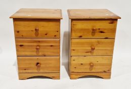 Pair of modern pine three-drawer bedside cabinets with knob handles, 70cm high x 48cm wide x 45cm