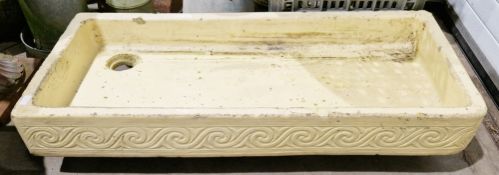 19th century glazed stone butler's sink of rectangular form with incised scroll decoration to front,