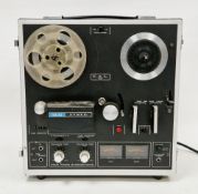 Vintage AKAI four-track stereophonic reel to reel tape recorder, model 1721L in built in transport
